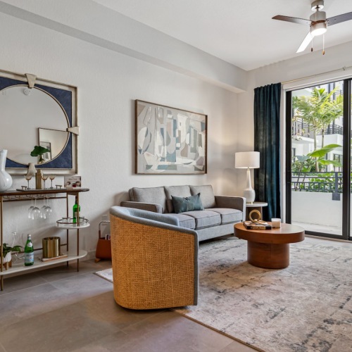 living room with a couch and chairs